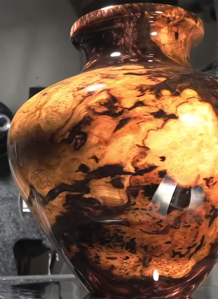 Finished burl and resin vase, glowing amber